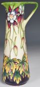 Moorcroft pottery slender jug decorated in the Aqueligia pattern, limited edition 69/250, height
