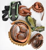 Six canvas and leather shotgun cartridge belts and a Loadmaster speed loading shotgun cartridge