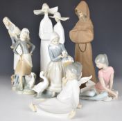 Seven Lladro figures including nuns, monk etc, tallest 34cm