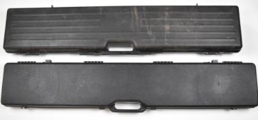 Two shotgun or rifle hard padded carry or flight cases Hoppe's Protecto and one other, largest