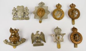 Eight British Army heavy cavalry cap badges including Household Cavalry, 5th Dragoon Guards and