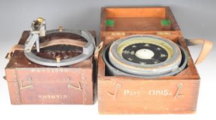 Pattern 0195A naval or similar military compass on gimballed mounts, together with a pattern 1950