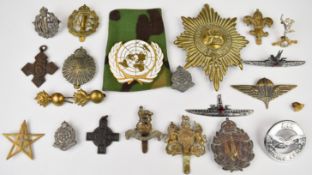 Twenty one military badges including Royal Flying Corps, Queen Mary's Auxiliary Army Corps,