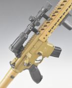 Sig Sauer MC .177 CO2 assault style air rifle with textured pistol grip, multi-shot magazine,