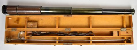 Vintage bore scope in fitted wooden box together with a three draw leather bound telescope.