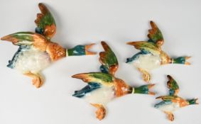 Set of four Beswick duck wall plaques, 569-0, 596-1, 596-2 and 569-4