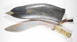 Large Kukri, overall length 70cm, with another small knife. PLEASE NOTE ALL BLADED ITEMS ARE SUBJECT