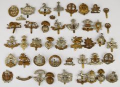 Forty three British Army Infantry cap badges including The Buffs, The Welch Regiment, East
