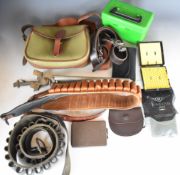 A collection of shooting and gun accessories including cartridge bag and belts, Parker-Hale