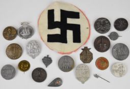 Twenty Nazi German 'tinnies' and a fabric swastika