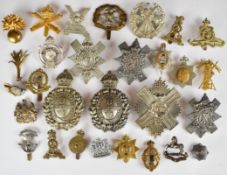 Twenty nine British Army metal badges including Highland Battalion Cyclists Territorial Force,