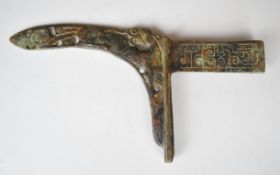 Ancient Bronze Age or similar dagger with pierced and embossed decoration and curved blade, 29cm