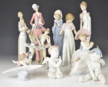 Nine Lladro / Nao figures including ballerinas, dog on a plane etc, tallest 28cm