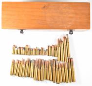 Forty-six deactivated rifle cartridges including .338, .465, .360, .404, 416 etc.