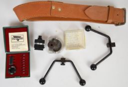A collection of target rifle parts and accessories comprising Anschutz rear sight iris and filter