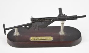 Metal model of a British Sten Mk II gun, on plinth, length 19cm