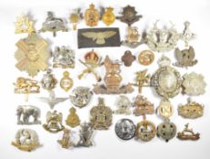 British Army cap badges including 19th Hussars, Worcestershire Regiment and Norfolk Regiment, some