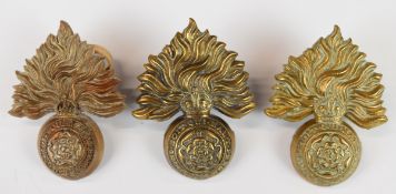 Three Royal Fusiliers (City of London) cap badges including WW2 plastic economy example by A Stanley