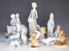 Lladro, Karl Ens and Goebel figures including children riding on an elephant, girl brushing her dog,