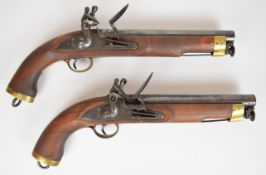 A pair of Sea Service style flintlock pistols, each with brass trigger guard and mounts, belt