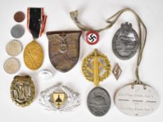 Eleven German badges including Wound Badge, Krim, Sports Badge and Tank Battle Badge