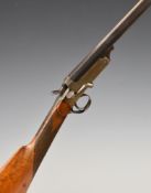 Unnamed .410 folding hammer action shotgun with chequered grip and 28 inch part octagonal barrel,