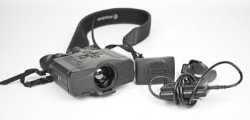 A pair of Pulsar Accolade XQ38 thermal binoculars with spare battery and charger.