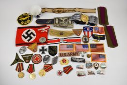 German reproduction armband, insignia and approximately 30 badges