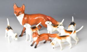 Beswick large and small foxes and six second version hounds, tallest 9cm
