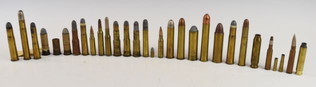 Thirty-one collector's mainly rifle cartridges including .577 Snider, .577-500, .475, Kynoch 12 bore