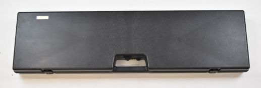 Six ABS shotgun hard carry cases with combination locks.