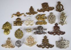 Fifteen British Army badges including Royal Artillery, The Buffs, Gloucestershire Regiment and