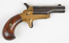 Colt Derringer .41 rimfire pocket pistol with brass frame, sheath trigger, shaped wooden grips and