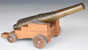Bronze desk or signalling cannon with 9 inch graduated multi-stage barrel on wooden carriage, 25cm