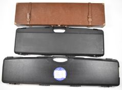 Three shotgun or rifle hard padded carry or flight cases including Huglu, largest 110x24x9cm.