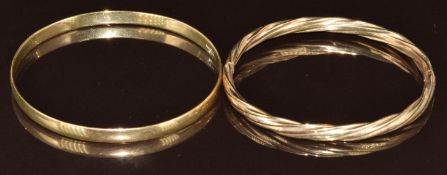 Two 9ct gold bangles, one of twisted design, 20.5g