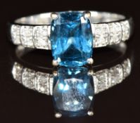 A 9k white gold ring set with a London blue topaz and diamonds, 3.2g, size Q