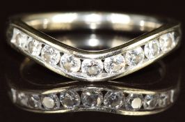 An 18k gold half eternity / wedding band / ring set with nine diamonds in a curved setting each