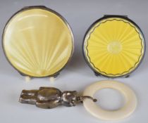 Two yellow guilloché enamel Art Deco compacts, one hallmarked silver Birmingham 1937 maker Adie Bros