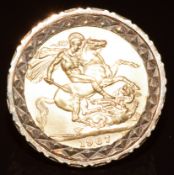 A 9ct gold ring set with a 1967 gold full sovereign, 16.9g, size P
