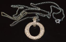 An 18k white gold pendant set with diamonds (2cm), on 18ct white gold chain (44cm), 7.4g