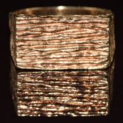 A 9ct gold ring with textured decoration, 10.2g, size Q