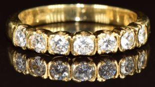An 18k gold half eternity ring set with seven round cut diamonds, each approximately 0.06ct, 3.1g,