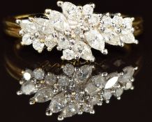 An 18ct gold ring set with marquise and round cut diamonds, 4.9g, size M