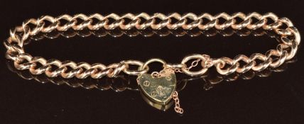 A 9ct rose gold curb link bracelet with heart padlock clasp, 22.2g, 20cm
