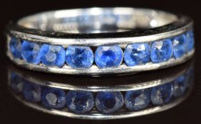 A 9ct gold half eternity ring set with nine round cut sapphires, each approximately 0.12ct, 2.4g,