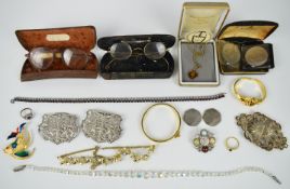 A collection of jewellery including two silver belt buckles, silver ring, diamanté necklace, etc