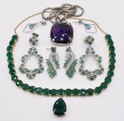 A collection of silver jewellery including emerald and topaz earrings, pendant set with amethyst and