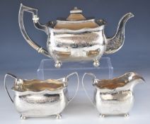 Irish Georgian hallmarked silver three piece tea set with engraved decoration, raised on ball