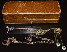 A 15ct gold stick pin set with a diamond and sapphire (1.2g), a section of 15ct gold necklace (2.1g)